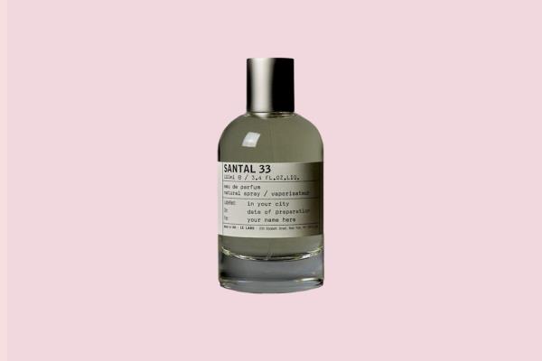 A bottle of perfume with a white label